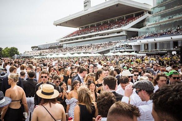 The crowd packs out the main lawn at Flemington on Derby Day in 2024.