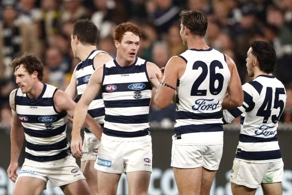 Geelong celebrates a goal.