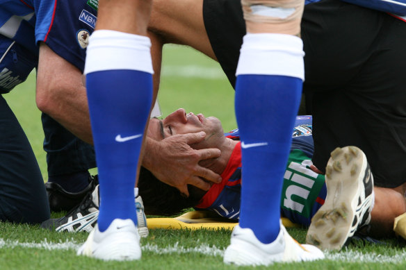 Newcastle star Andrew Johns is stretchered from the field after a hit from Canterbury’s Sonny Bill Williams.