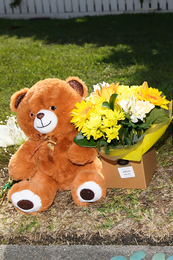 Flowers and other items were still being left at the scene on Saturday, three days after the murder-suicide.