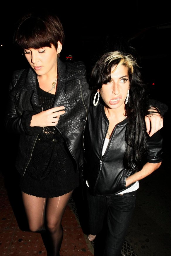Stylist and friend Naomi Parry and Amy Winehouse leaving the Diner Bar in Camden after a night out.