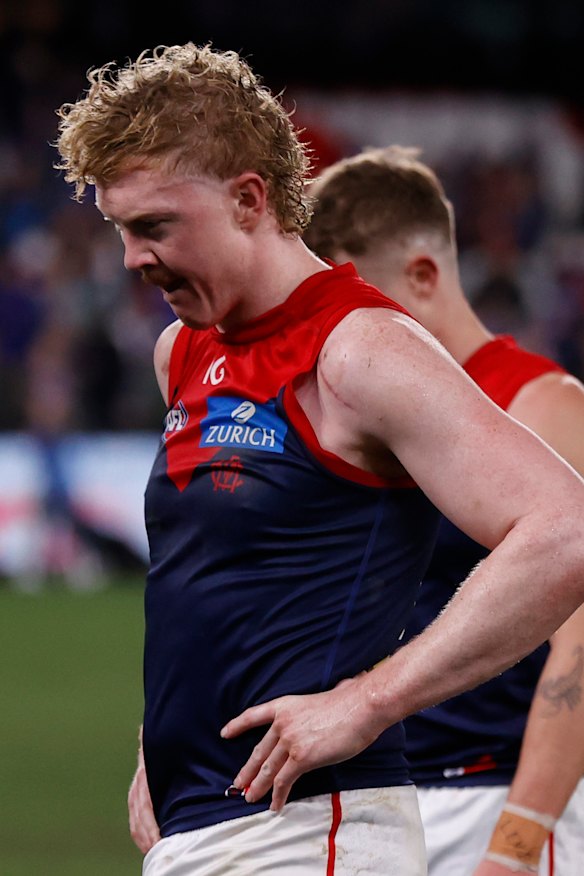 A dejected Clayton Oliver leaves the field after Friday night’s match.