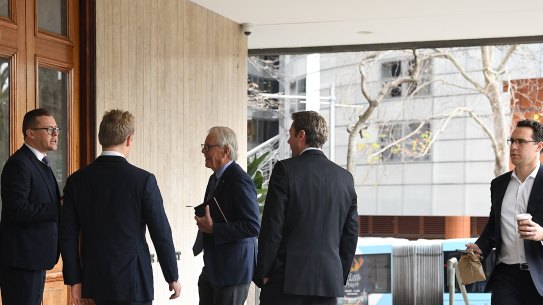 Men arrive at the men’s only Australian Club for the vote on whether to allow women as permanent members.