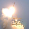 The first Tomahawk missile to be fired into Iraq is launched from the USS Bunker Hill.