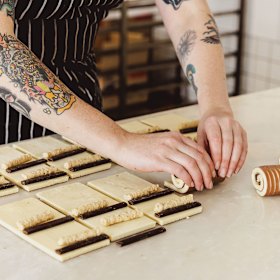 Rolling the pastry by hand.