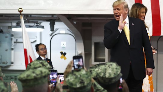 President Donald Trump and first lady Melania Trump visit a US naval base in Japan on Tuesday.