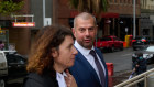 Tolga Kumova approaches the Federal Court with barrister Sue Chrysanthou.  