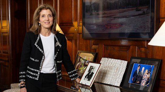 US ambassador to Australia Caroline Kennedy at her residence with a signed portrait of her father, Us President John F Kennedy