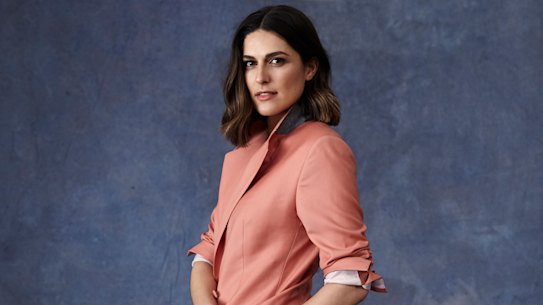 Sarah wears E Nolan suit, Arms of Eve jewellery. 