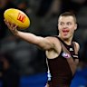 Hawthorn’s Jack Ginnivan shows the ball to an opponent.