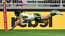Esom Ioka of the Cook Islands crosses for a try.