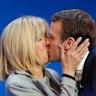 Macron kisses his wife Brigitte on election day in 2017.