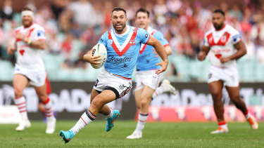 Roosters captain James Tedesco charges down field.