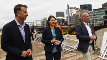 Transport Minister Andrew Constance, left, Premier Gladys Berejiklian and Sydney Metro chief executive Jon Lamonte inspect work at Central Station on Monday.
