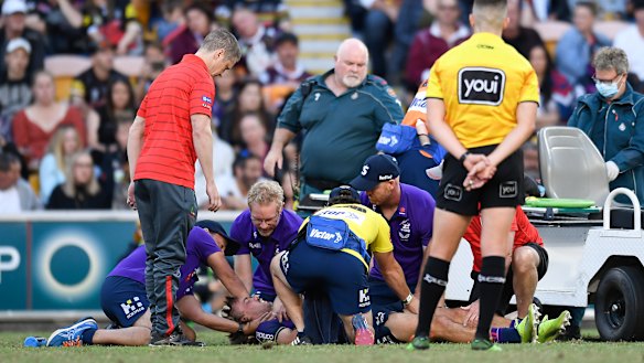 Ryan Papenhuyzen receives medical attention after Tyrell Fuimaono’s hit.