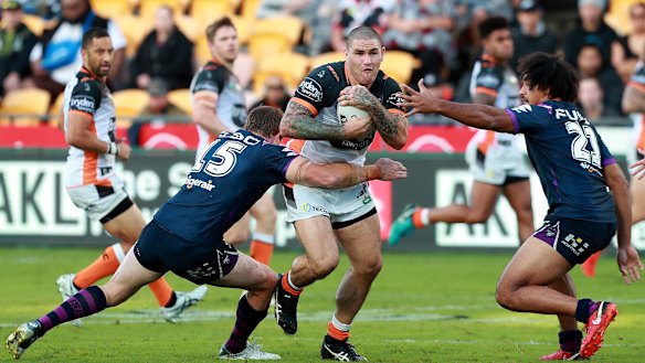 Hard yards: Captain Russell Packer spots some pace in the Storm defence.