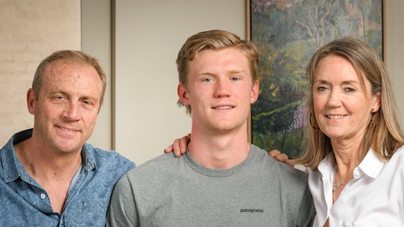 Fischer McAsey with his parents Chris and Gina.