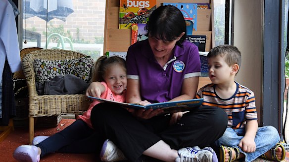 Early learning educator Samantha Kenny with Zahra Khodr and Benjamin Perovic.