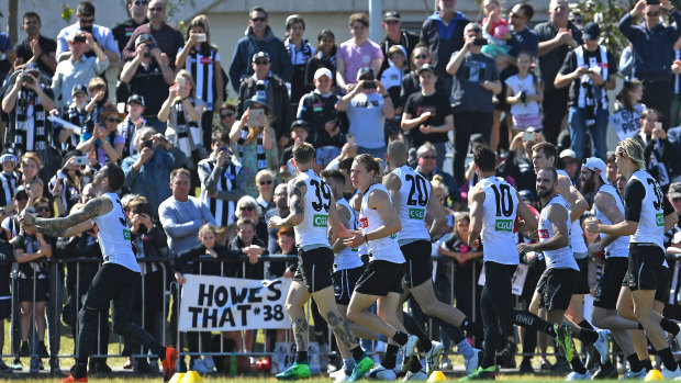 Cheer squad: Thousand of fans turned out for Collingwood's final training session before the AFL Grand Final.