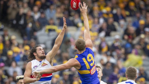 Good touch: Eagle Nathan Vardy goes up against Tom Boyd of the the Bulldogs.