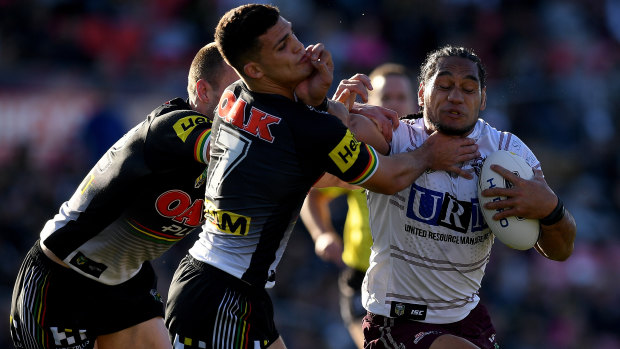 Don't argue: Martin Taupau of the Sea Eagles fends off Nathan Cleary at Panthers Stadium.