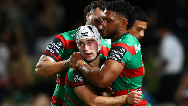 Jye Gray is congratulated by teammates during the match against the Dragons.