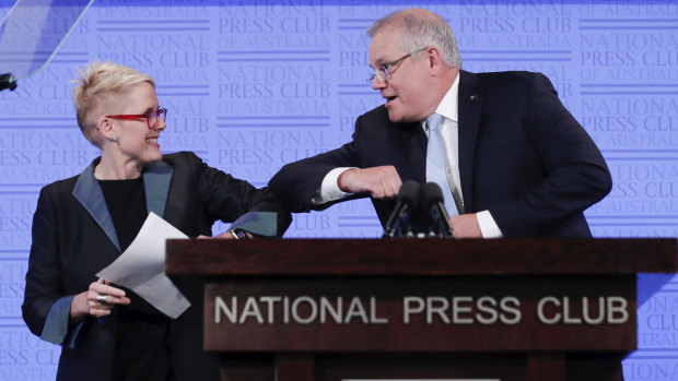 AM host Sabra Lane giving Prime Minister Scott Morrison a socially-distant 'elbow bump' greeting earlier this year.