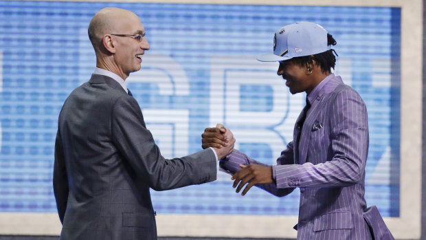 Ja Morant, the No.2 NBA draft pick, is greeted by NBA commissioner Adam Silver after being taken by Memphis.