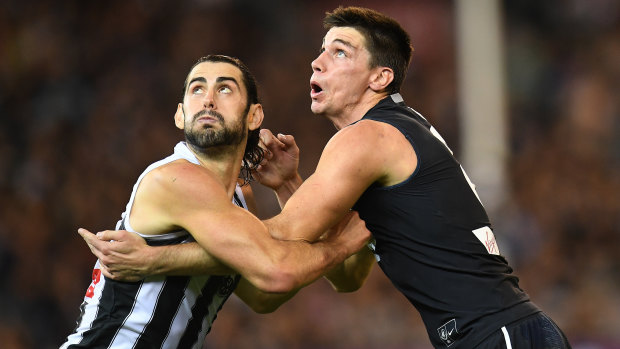 High and mighty: Collingwood's Brodie Grundy and Carlton's Matthew Kreuzer.
