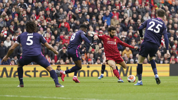 Mohamed Salah strikes from distance for the Reds' opening goal.
