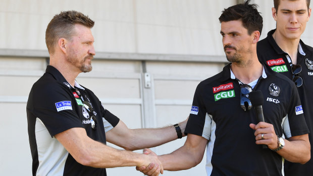 Nathan Buckley and Scott Pendlebury share a moment on stage at Collingwood's family day.