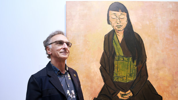 Tony Costa with his Archibald Prize-winning portrait of artist Lindy Lee.