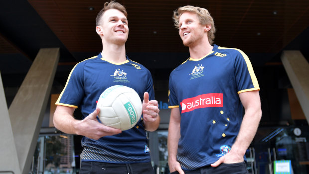 Rory Sloane (right) and Robbie Gray promote the hybrid rules series in 2017.