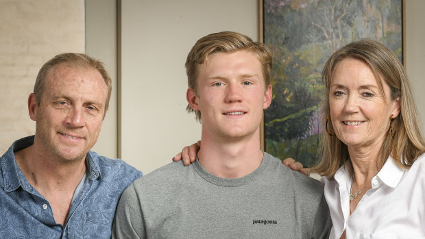 Fischer McAsey with his parents Chris and Gina.