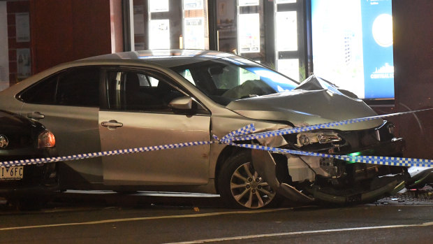 The smashed car at the scene of the incident. 