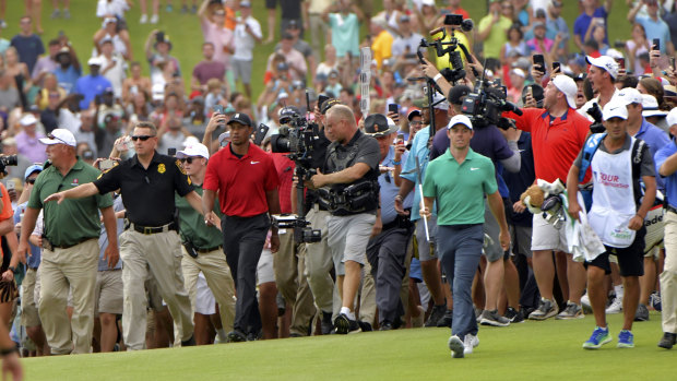 Tiger's army: Tigers Woods walks up the 18th at the Tour Championship.