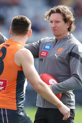James Hird, chatting with Giants captain Stephen Coniglio, was back in the AFL fold last season.