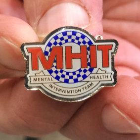 NSW Police who completed mental health training were given a badge to notify ambulance workers and people affected by mental illness.