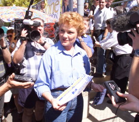 Pauline Hanson collecting the how to vote form for One Nation before going in to vote at Ipswich North Primary School, 1998.