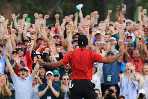 Tiger Woods celebrates with the crowd after sinking his winning putt at Augusta to win the US Masters in April.