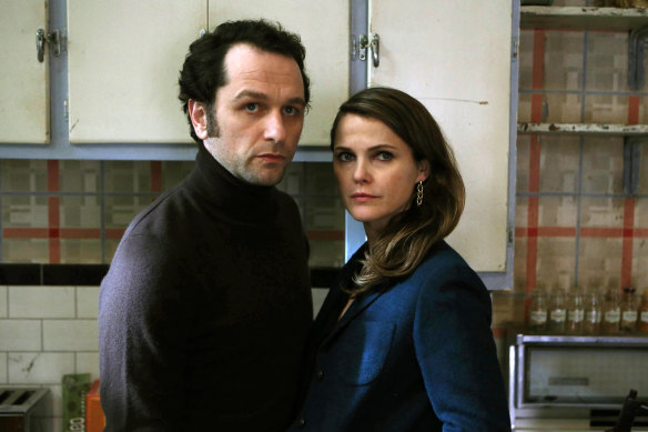 In this image released by FX, Matthew Rhys, left, and Keri Russell in The Americans