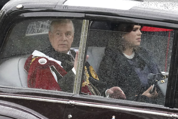 Prince Andrew and Princess Eugenie travel along The Mall ahead of the coronation ceremony of King Charles.