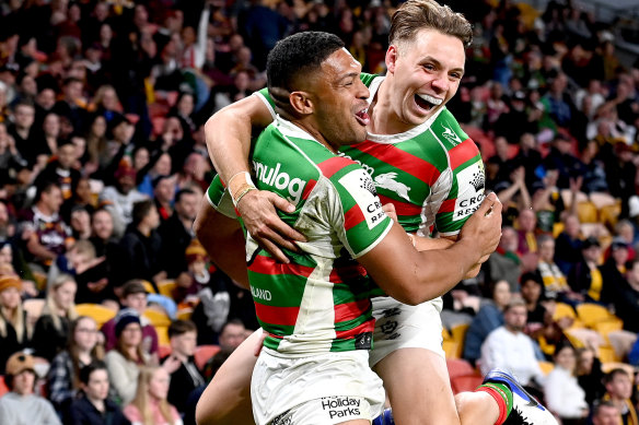 Rabbitohs winger Taane Milne (left) celebrates a try with Blake Taaffe.