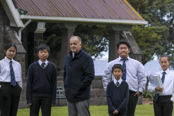 Mark Dooley, head of school at Avalon College, with students Julia, Issac, Mick, Owen and Angel.