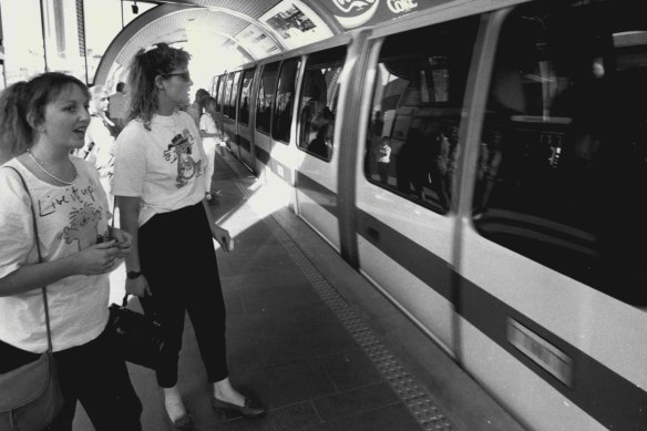 Debbie Meehan (right) with Gillian Burton of Melbourne wait to board the Sydney Monorail on August 21, 1988. 