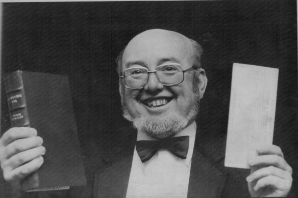 Thomas Keneally displays his cheque and book, after he was awarded the 1982 Booker Prize.