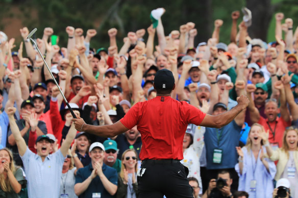 Tiger Woods celebrates after sinking his winning putt at Augusta to win the US Masters in April.