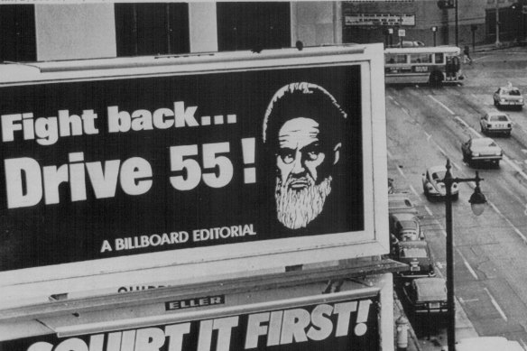 San Francisco, January 1980: The image of Iran's Ayatollah Khomeini is used to encourage motorists to conserve petrol.