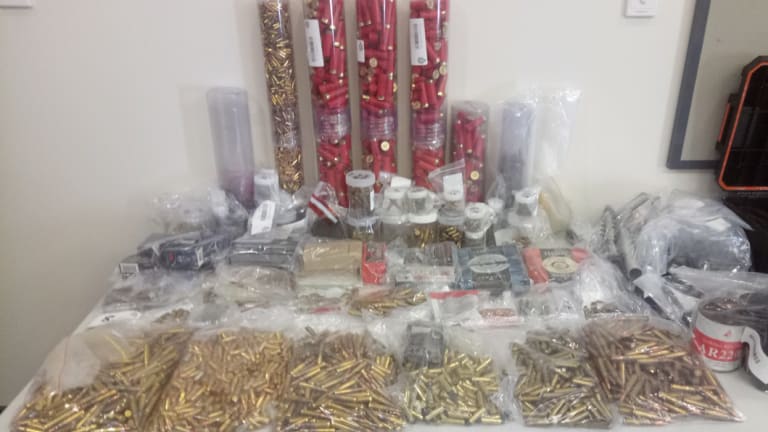 Reams of ammunition were seized after police executed a search warrant on a Belmont home. 