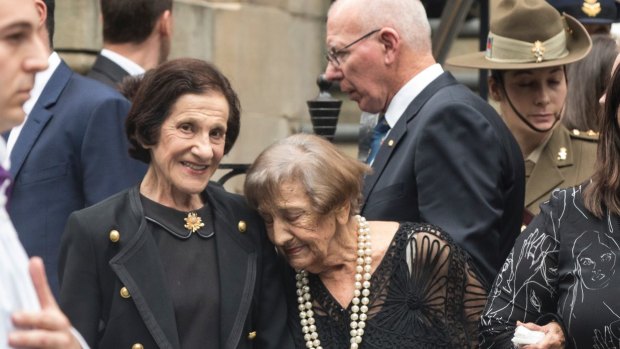 Marie Bashir stands with family after the funeral of her husband Sir Nicholas Shehadie at St James Church.